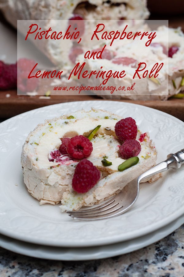 slice of pistachio, raspberry and lemon meringue roll on a plate