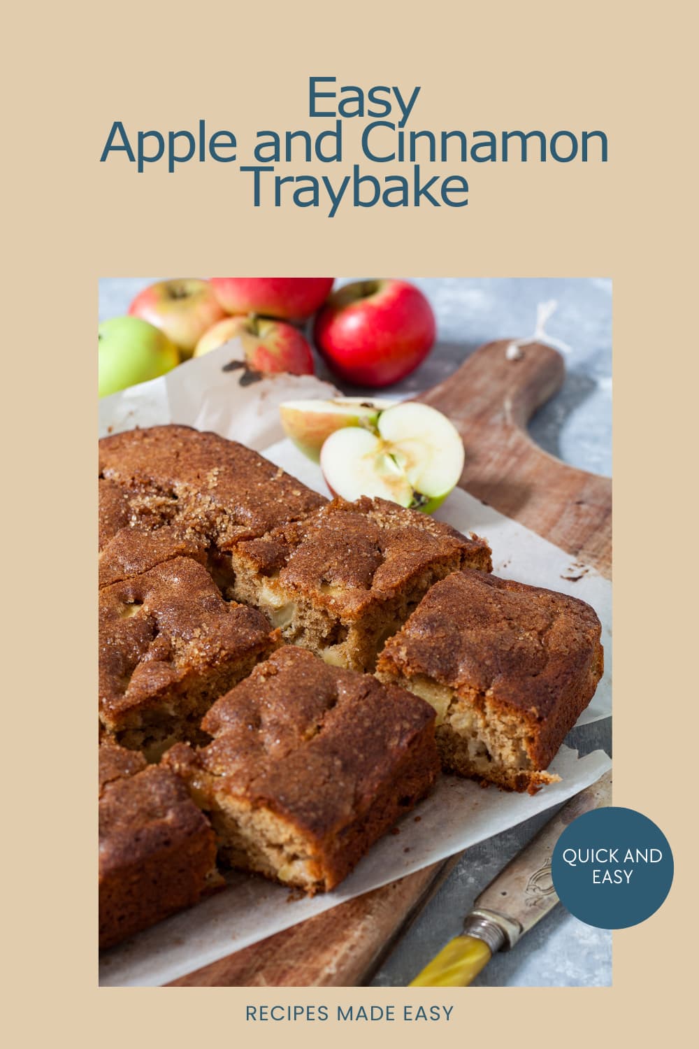 apple and cinnamon traybake on board cut into squares. fresh apples behind.