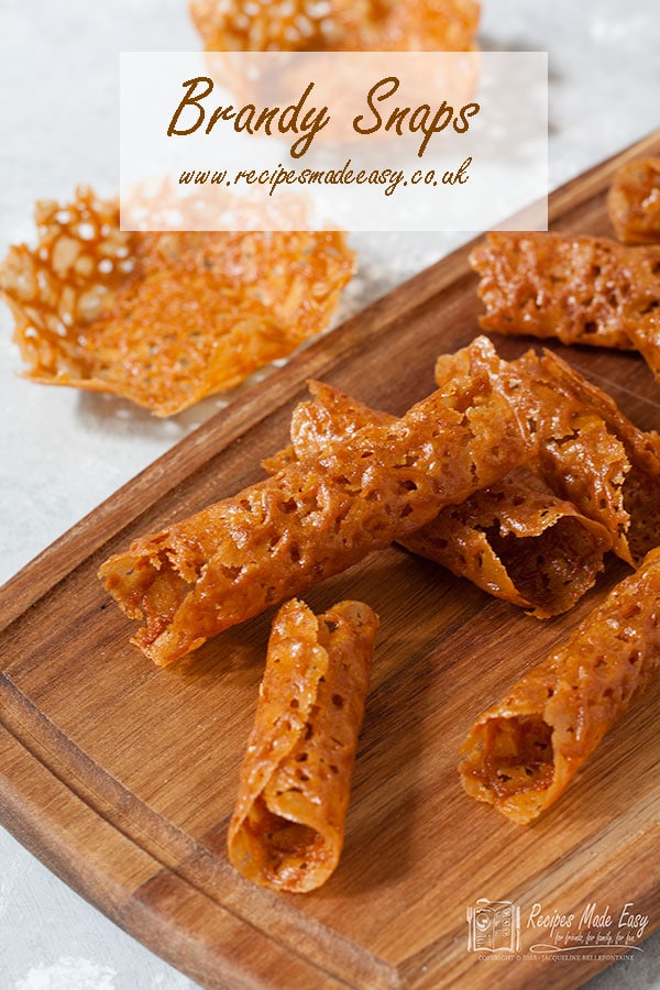 brandy snaps and brandy snap baskets on a wooden board