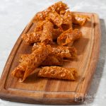 Brandy snaps on a wooden board