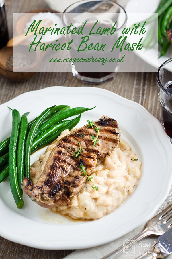 serving of marinated lamb with haricot bean mash with green beans on the side.