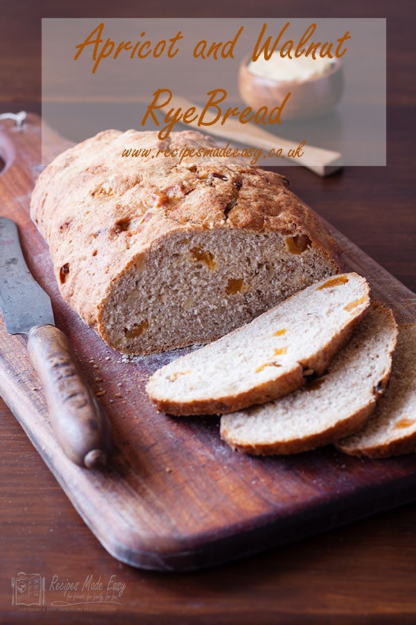 sliced apricot and walnut rye bread on a wooden board