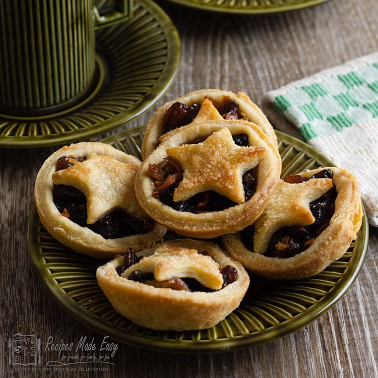 Easy Mince pies on a plate with coffee cup behind