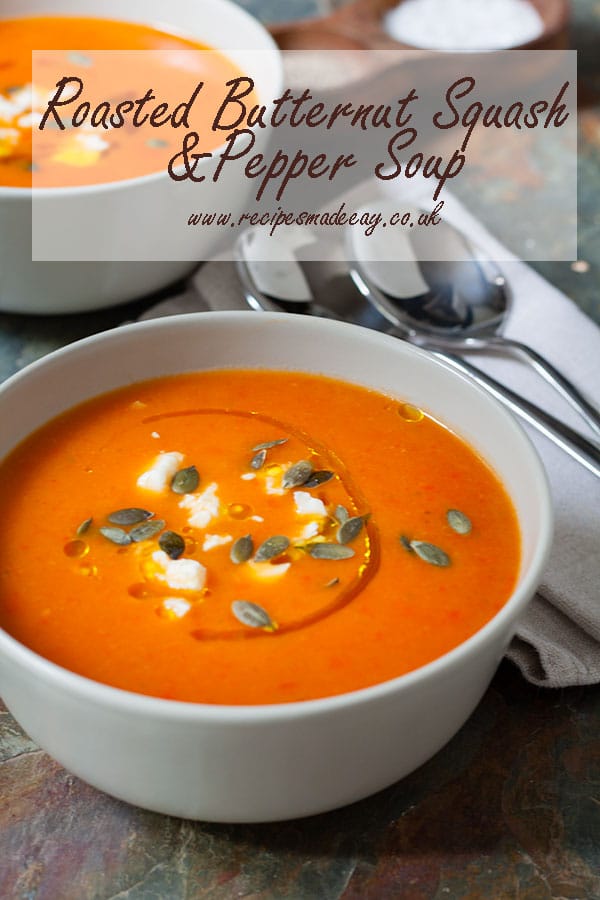 bowl of roasted butternut squash and pepper soup with spoons and napkins on the side