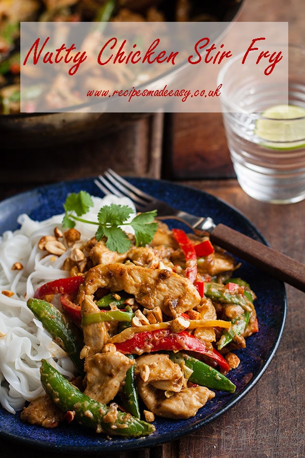 plate of nutty chicken stir fry with recipe name over laid