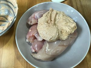 chciken in a bowl with marinade