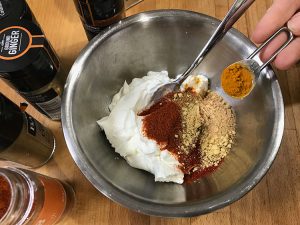 adding spices to the yogurt
