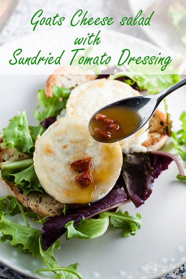 Sindried tomato dressing spooned over goat's cheese salad
