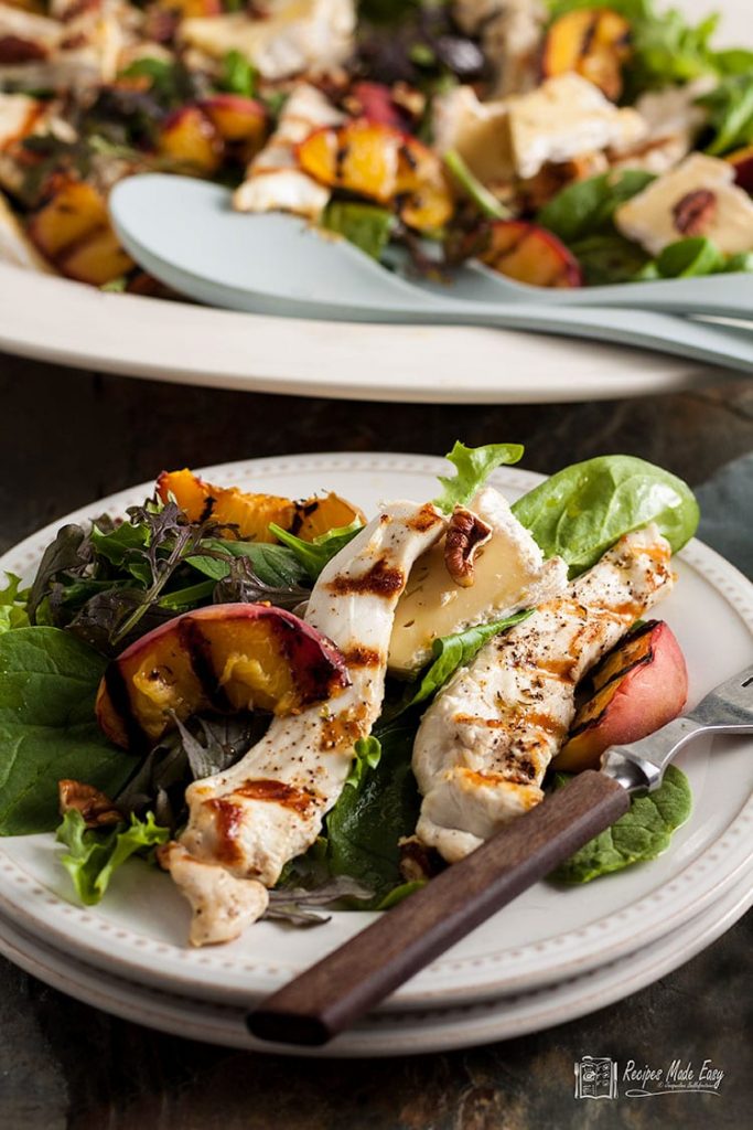 plate of warm chicken and brie salad