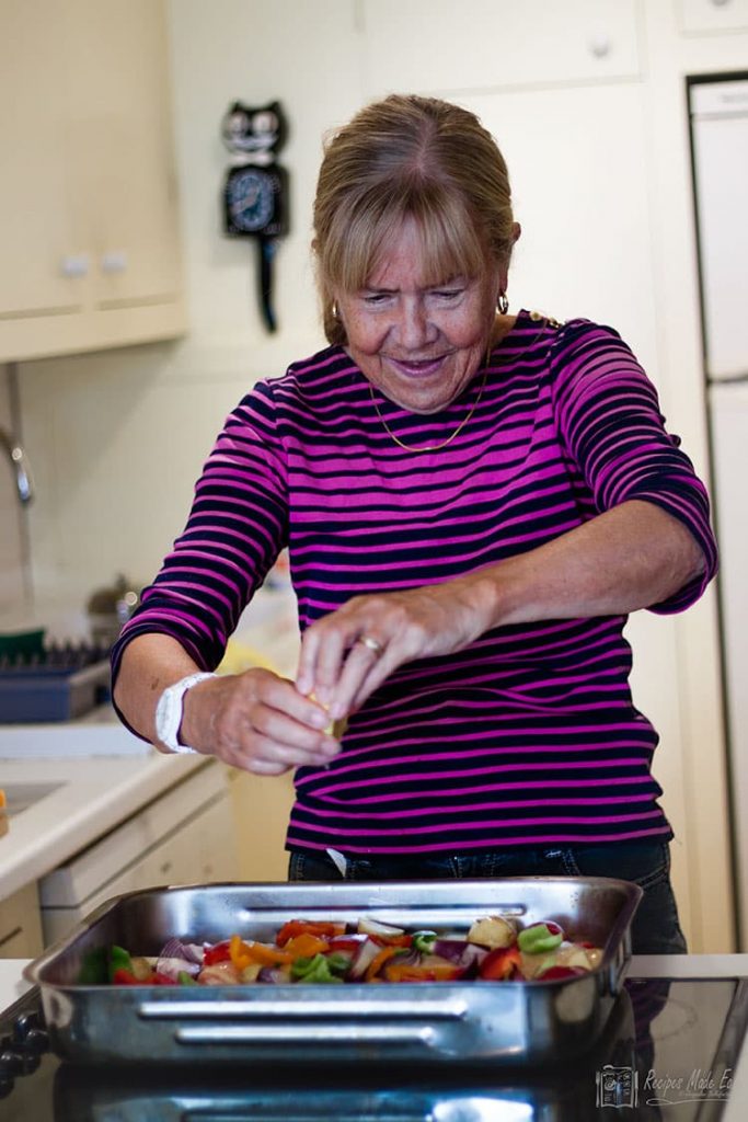 Wendy Squeezing lemon juice over dish.