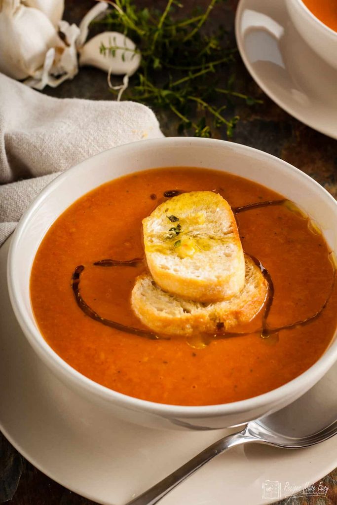 bowl of roasted tomato soup with croutons