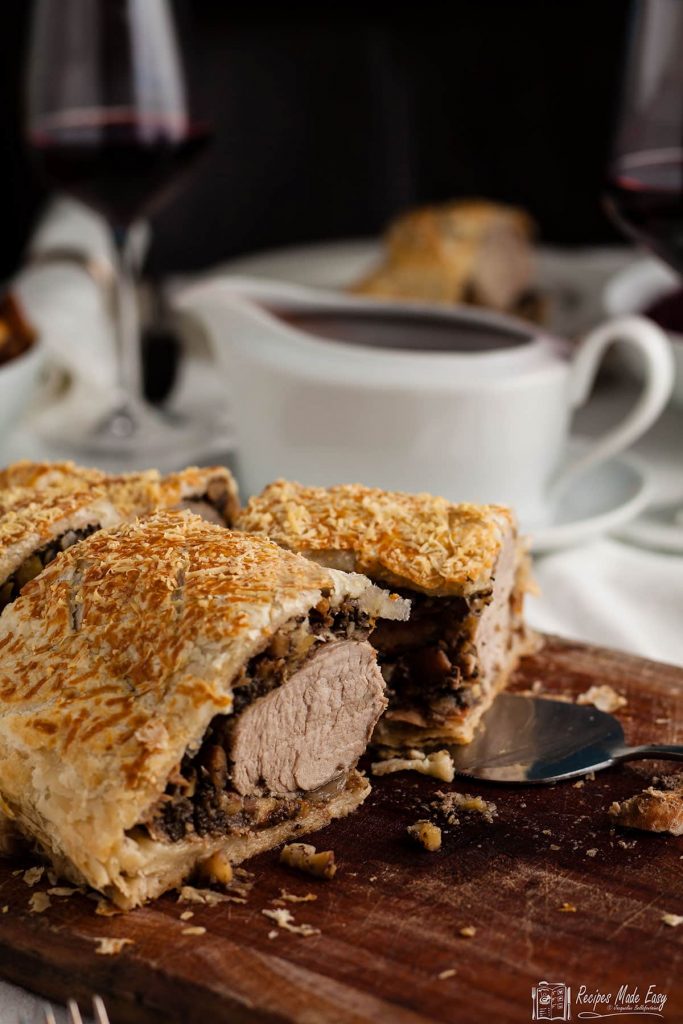 pork and chestnut wellington on a board.