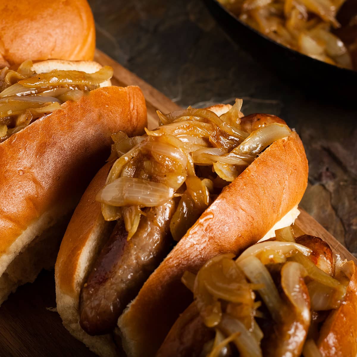 hot dogs topped with sweet and sour onions.