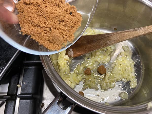 adding sugar to pan