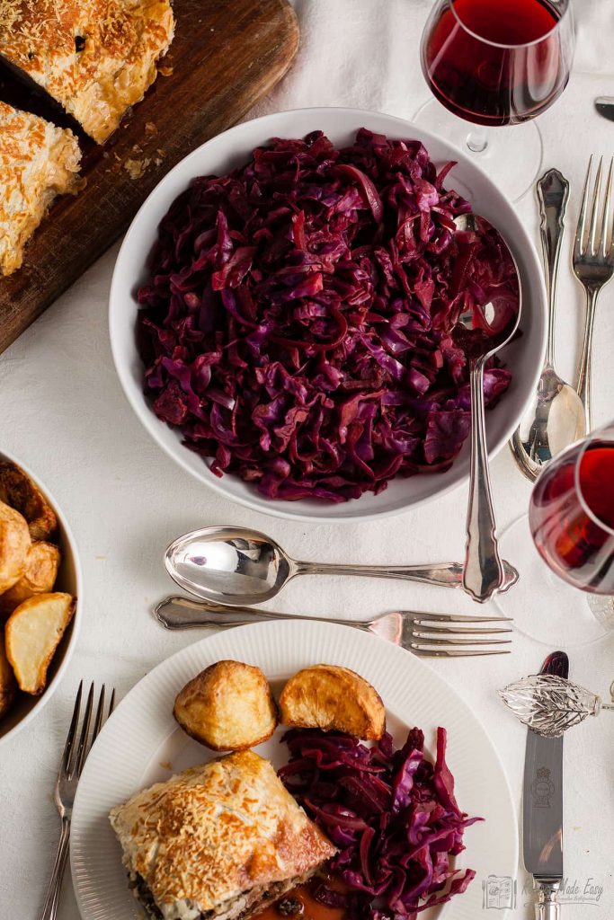 bowl of red cabbage in centre of dining table.
