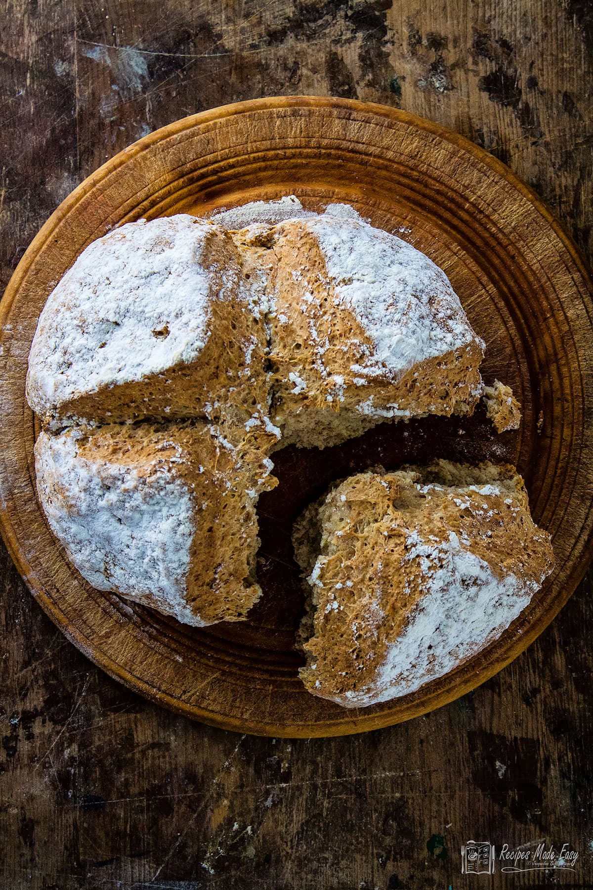 Irish soda bread on round board.