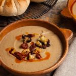 bowl of roasted cauliflower soup topped with chorizo