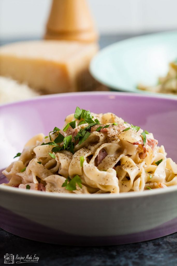 bowl of easy cheesy garlic and herb pasta.