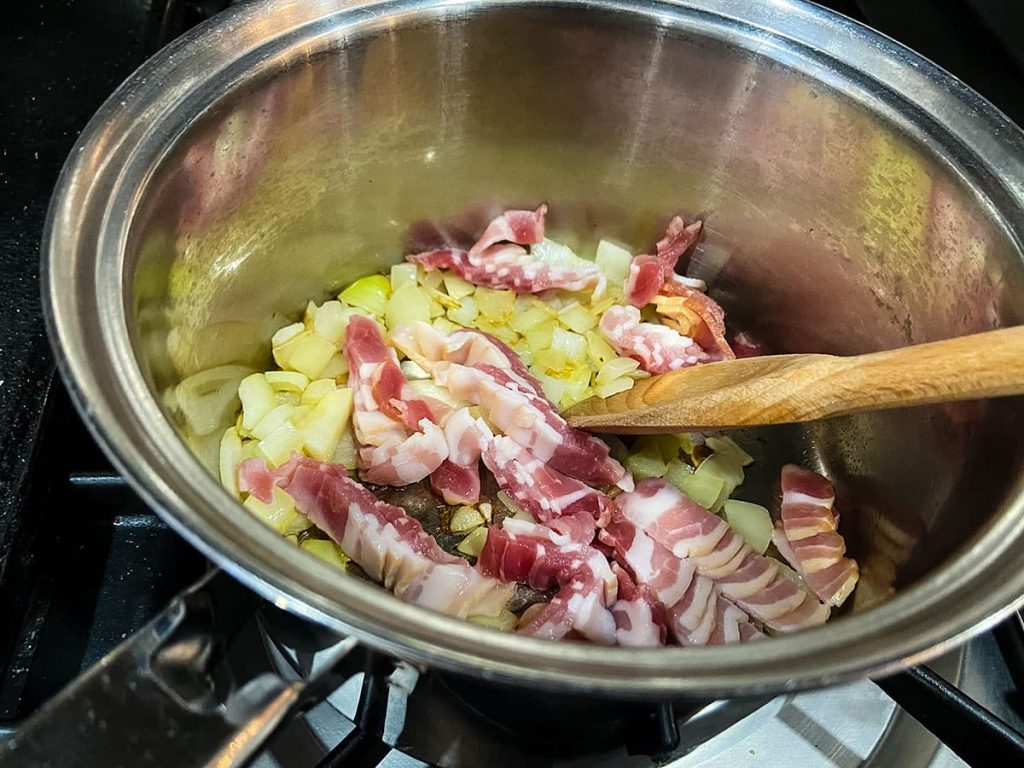 bacon and onions in saucepan.