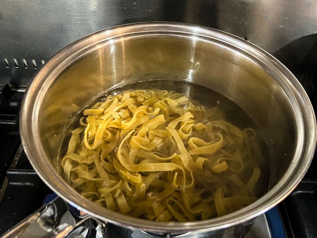 Tagliatelle in pan of water.
