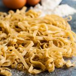 pile of tagliatelle on work surface.