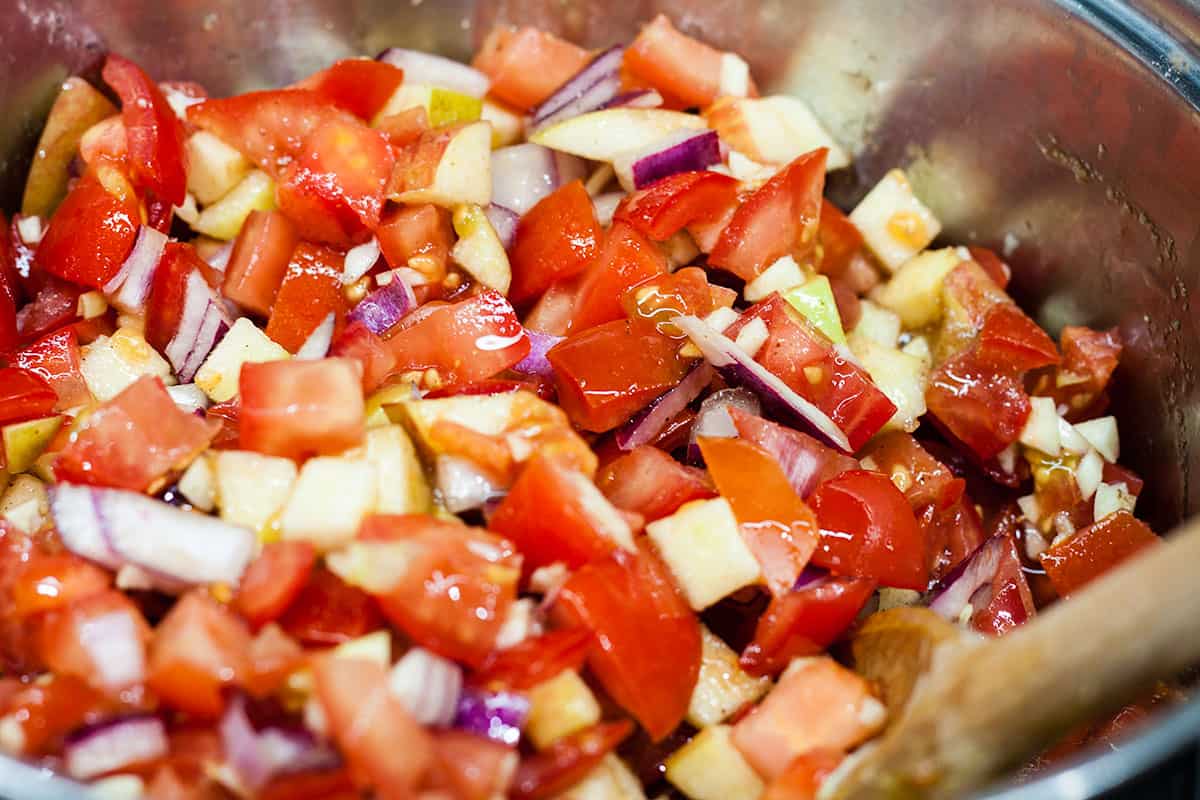 all ingredients for tomato chutney in preserving pan.