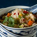 bowl of egg fried rice with rice spoon.