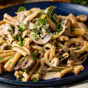 easy creamy mushroom pasta sprinkled with chopped parsley.