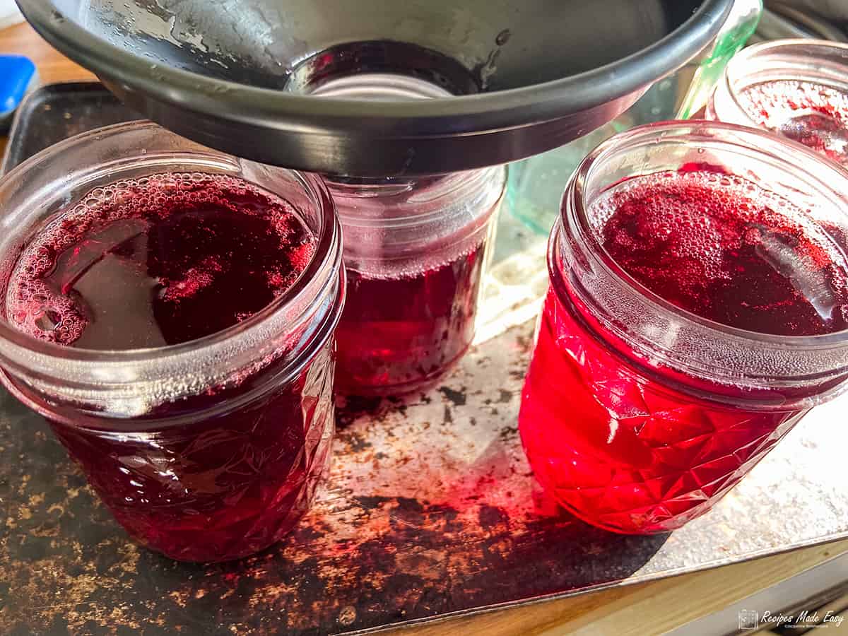 Pouring jelly into jars.