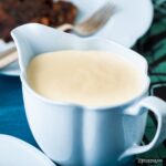 Brandy sauce in a blue jug.