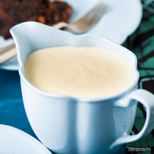 Brandy sauce in a blue jug.